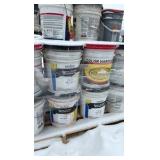 Pallet of buckets of color hardener for concrete