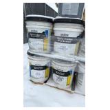 Pallet of buckets of color hardener for concrete
