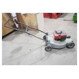 Craftsman gas-powered, self-propelled walk-behind lawn mower.