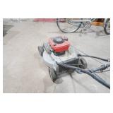 Craftsman gas-powered, self-propelled walk-behind lawn mower.