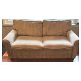 SR - Grey Upholstered Couch with Floral and Green Throw Pillows