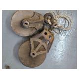 Barn pullys, hay hook, scissors, and a cast grill cover