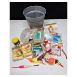 Silver pail full of random fishing items