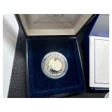 Five Coins: 1958 and 1959 Proof Jefferson Nickels; 1999 Proof Susan B. Anthony Dollar in U. S. Mint Package with COA; Two 1986-D Uncirculated Half Dollars