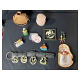 Collection of Vintage Curiosities Including Pottery Canteen, Figurines, Coasters, and Decorative Items