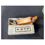 Collection of Vintage Curiosities Including Pottery Canteen, Figurines, Coasters, and Decorative Items