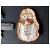 Collection of Vintage Curiosities Including Pottery Canteen, Figurines, Coasters, and Decorative Items