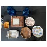 Eclectic Decorative Collection with Blue Glass Bottles, Plates, Wood Dish, and Longaberger Basket