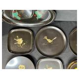 Collection of Vintage Metal Trays and Plates with Artistic Designs