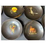 Collection of Vintage Metal Trays and Plates with Artistic Designs