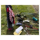 Golf Clubs in A Golf Bag, Ice Bucket, Etc.