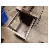 Tool shop drill press mounted to a metal cabinet