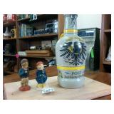 Vintage Ceramic Beer Growler with handle and two vintage bavarian figurines.
