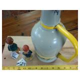 Vintage Ceramic Beer Growler with handle and two vintage bavarian figurines.