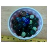 Cup chock full of Vintage Cats Eye Marbles