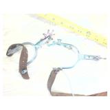 Stirrups with copper colored spurs