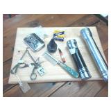 Early 1900s magic scratch removers  vintage flash lights  vintage inkwell and stylus  stainless hand warmer  Tiffen retaining rings