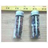 Two tubes of polished agates