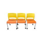 3 Steelcase Stackers on Wheels- Orange/Yellow