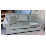 Upholstered Sleeper Couch with tags still on it