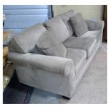 Upholstered Sleeper Couch with tags still on it