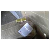 Upholstered Sleeper Couch with tags still on it