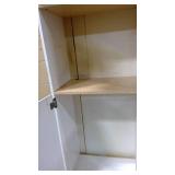White and wood kitchen pantry cabinet
