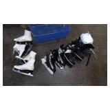 Tote with two pairs of hockey skates, 2 pairs of figure skates, and hockey helmet