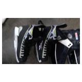 Tote with two pairs of hockey skates, 2 pairs of figure skates, and hockey helmet