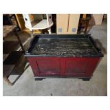 White Dresser, Red Chest, and Wooden Table