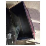 White Dresser, Red Chest, and Wooden Table