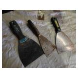 Lot of Hand Tools including Caulking Guns, Scrapers, and Grinding Disc