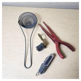 Fishing Tackle and Tools Including Pliers, Multi-tool, and Sinkers
