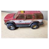 Tonka and Nylint Toy Vehicle Lot including Tonka Trailer, Nylint Fire Truck, and Tonka Bucket Truck