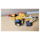 Toy construction vehicles including a toy backhoe loader, yellow toy car, and blue toy car