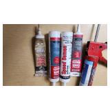 Caulking Gun and Sealant Lot including Red Devil Speed Demon, DAP Kwik Seal Plus, and Other Sealants