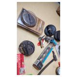 Assorted Automotive Parts Lot including Dorman Sending Unit Retainers, Autolite Spark Plugs, and Anti-Theft Door Lock Knobs