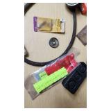 Assorted Automotive Parts Lot including Dorman Sending Unit Retainers, Autolite Spark Plugs, and Anti-Theft Door Lock Knobs