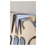 Assorted Hardware and Tools including Shelf Brackets, Wooden Dowels, and Cable Spool