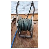 Hose reel and garden tools including hose reel, soil augers