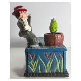 This classic piece is a must-have for collectors of mechanical banks and unique Americana decor! Featuring a charming fisherman theme, this cast iron bank offers both visual appeal and interactive fun