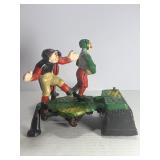 VINTAGE "CALAMITY" CAST IRON MECHANICAL COIN BANK - FOOTBALL/RUGBY THEME