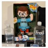 FR - Fred-Themed Collectibles Set Including Plush, Cards, Book, Tote, and Memorabilia