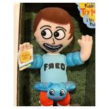 FR - Fred-Themed Collectibles Set Including Plush, Cards, Book, Tote, and Memorabilia