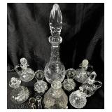 Large Collection of Glass Cruets and Decanters with Stoppers