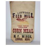 Vintage Kitchenware Collection with Texas Ware Bowl, Fire-King Cup, Glass Jar, and Feed Mill Sack