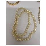 Vintage Jewelry Collection with Pearl Necklace, Gold-Tone Bracelet, Chain Bracelet, and Brooch