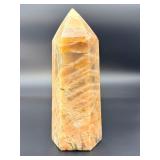 A large regular moonstone generator tower featuring a smooth, creamy sheen with gentle pearlescent glow.