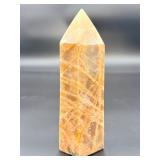 A large regular moonstone generator tower featuring a smooth, creamy sheen with gentle pearlescent glow.