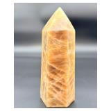 A large regular moonstone generator tower featuring a smooth, creamy sheen with gentle pearlescent glow.